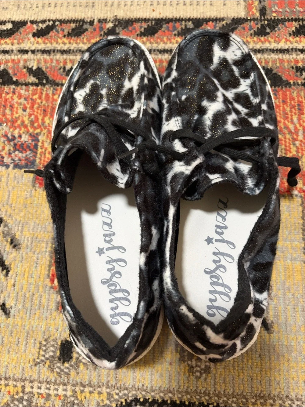Gypsy Jazz Black & White Cow Print Slip-On Sneakers